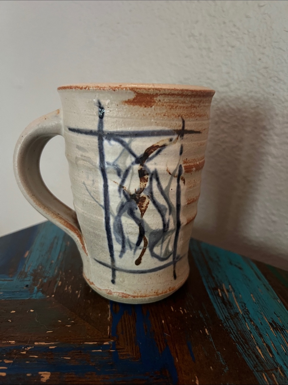 Hand Crafted Cream Ceramic Mug with Blue and Brown Brushwork